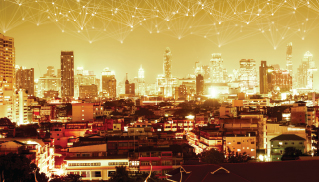 A glowing city skyline at dusk with illuminated buildings and a warm, golden hue. Abstract network lines above suggest connectivity and innovation.