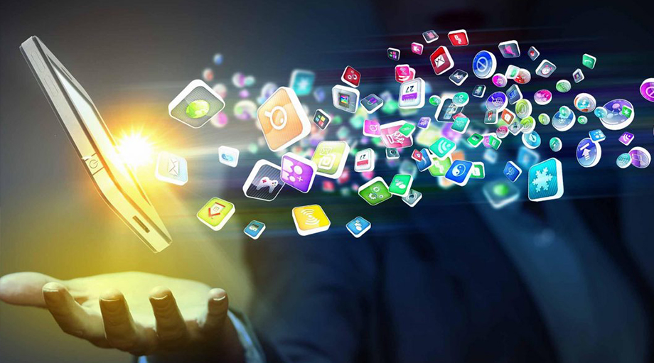 A hand holds a glowing smartphone, emitting colorful app icons that float into the air. The scene conveys innovation and digital connectivity.