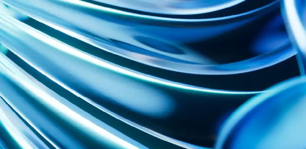 Abstract image with fluid, wavy blue light trails creating a dynamic, futuristic effect. The smooth curves and gradients evoke a sense of motion.