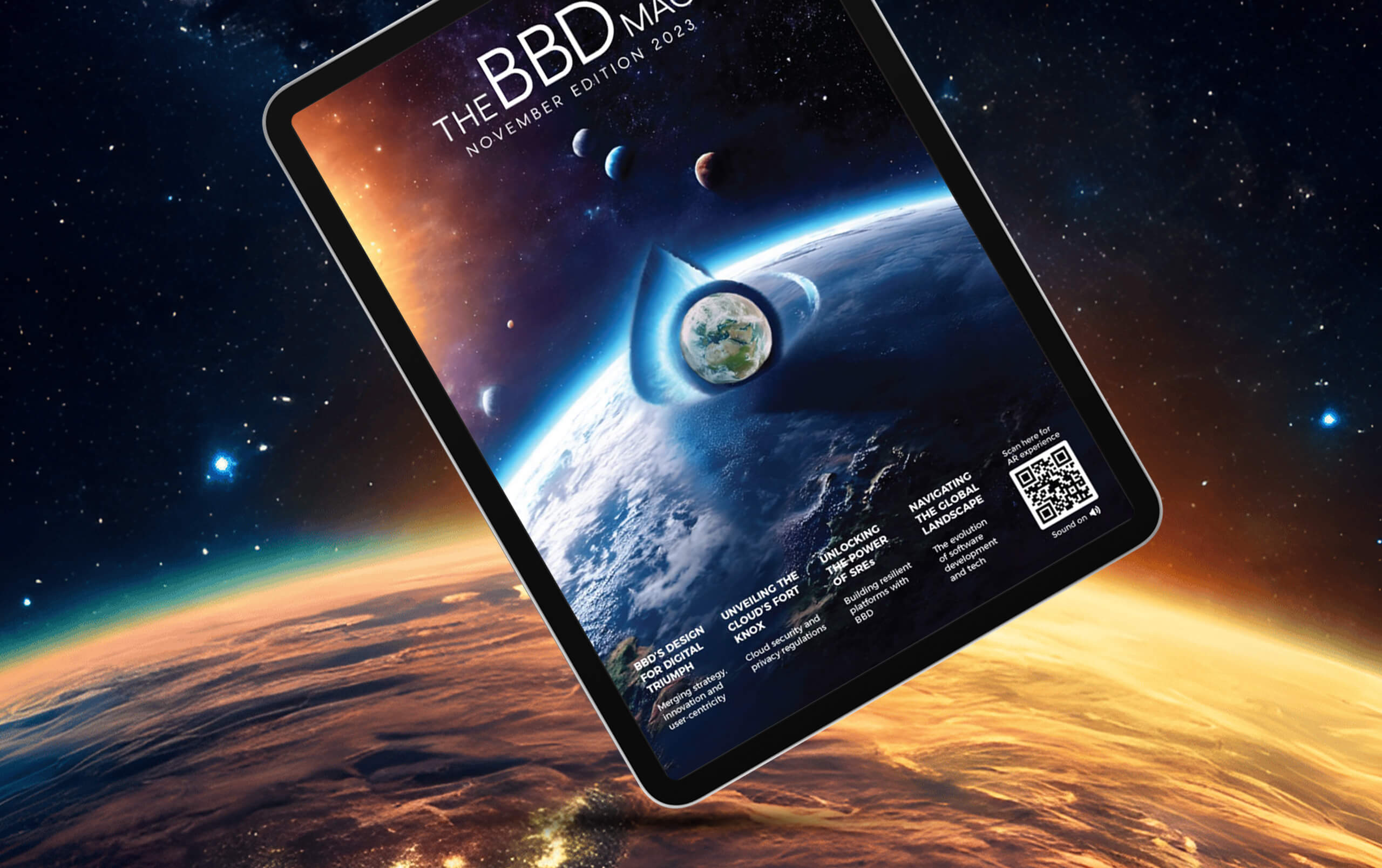 A tablet displays the cover of "The BBD Magazine" November 2023 edition against a space background. The cover features Earth with planets, highlighting an astronomical theme.