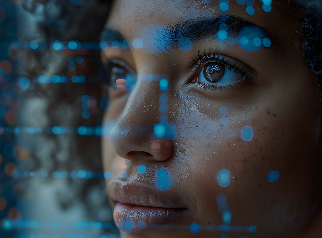 A close-up of a person's face with curly hair, overlaid with blue digital dots and lines, creating a futuristic, contemplative tone.
