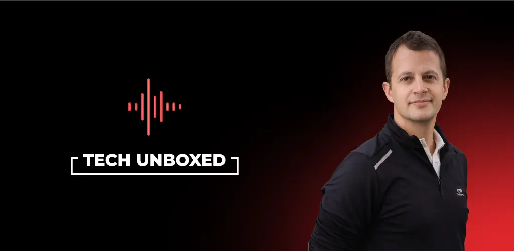 Man in black jacket on a red and black gradient background. To his left, the text "Tech Unboxed" appears with a red sound wave icon above.