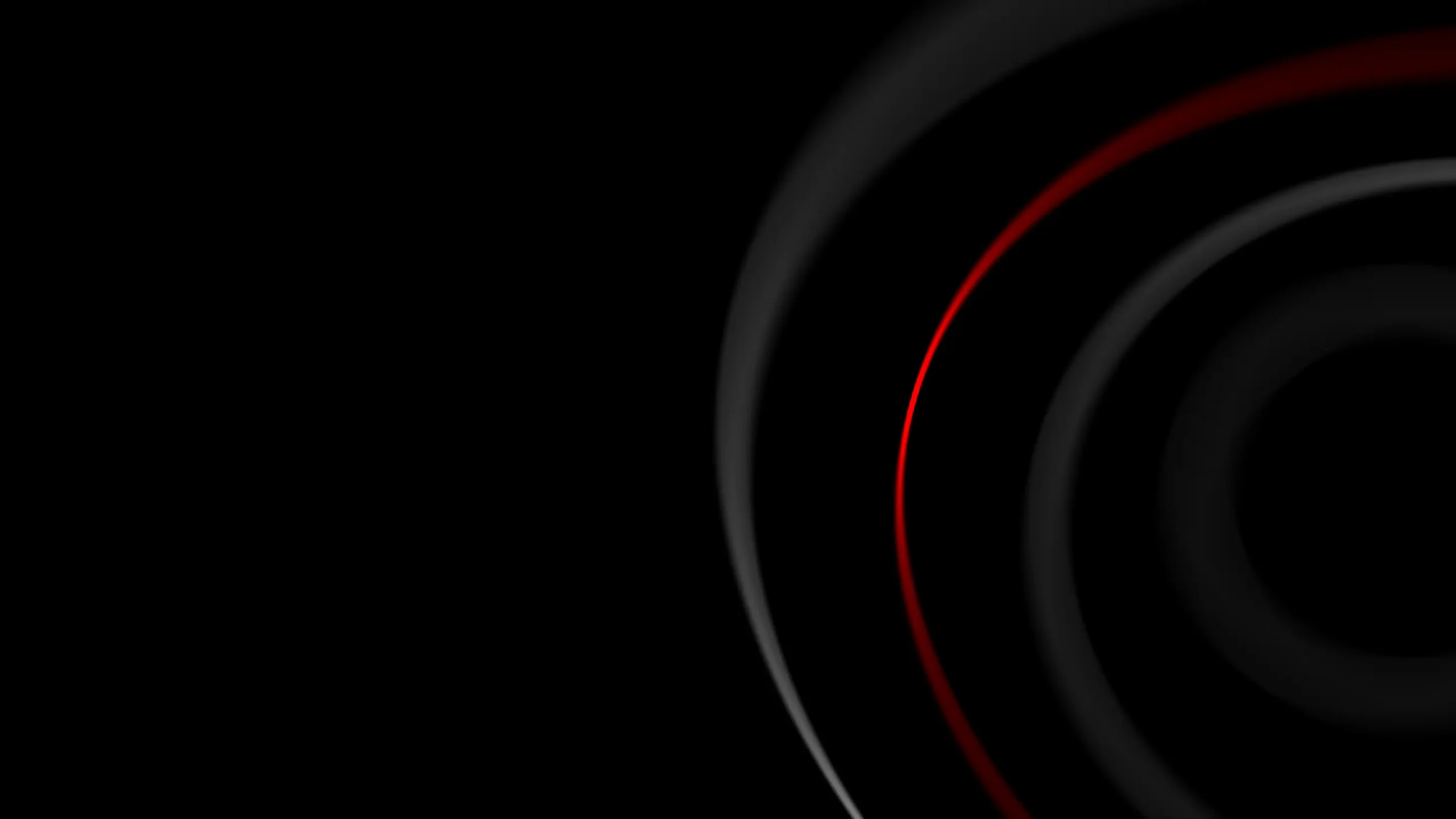 Abstract image with concentric black circles on a dark background, featuring a bold red arc. The contrast conveys a sense of mystery and depth.