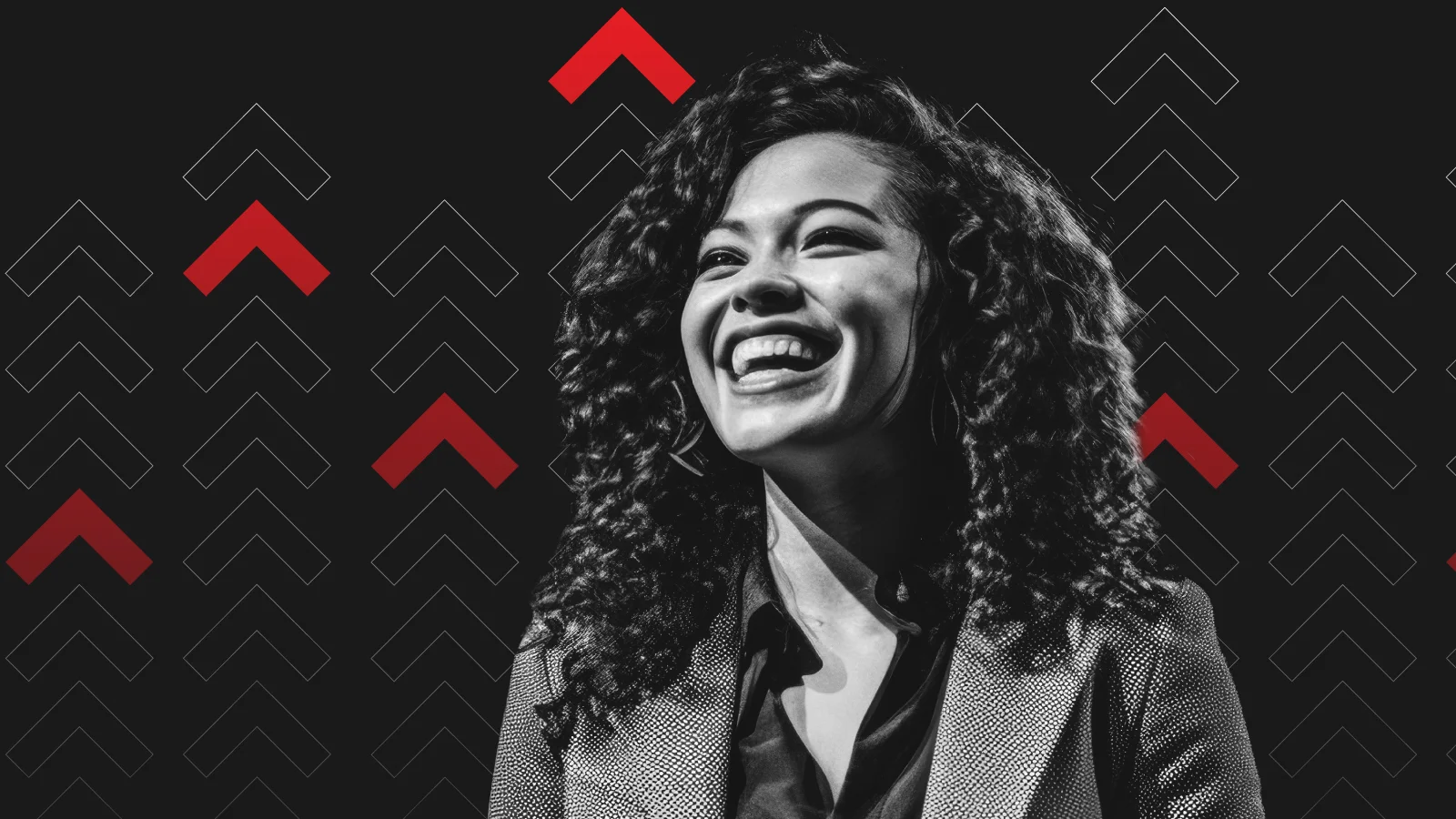 Smiling woman with curly hair in grayscale, wearing a suit against a black background with ascending red and white arrows. Energetic and uplifting mood.