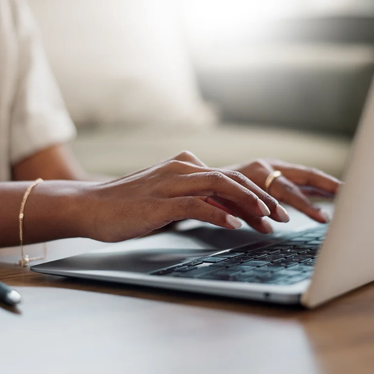 Close-up of a person typing on a laptop, symbolising Data Engineering work and focus.